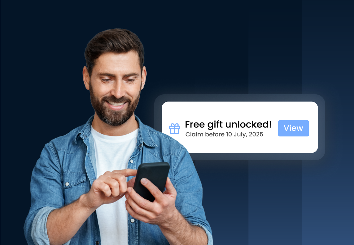 Man smiling at phone with "Free gift unlocked!" notification