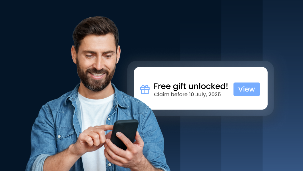 Man holding phone smiling with a 'free gift unlocked' notification